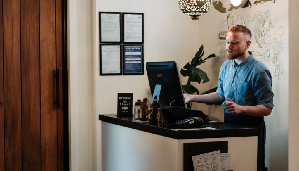 Empty hotel reception lit at night, where a lone hospitality worker may cover a shift alone in Cumbria