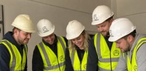 A workplace training session in progress with a Cumbria employer's team