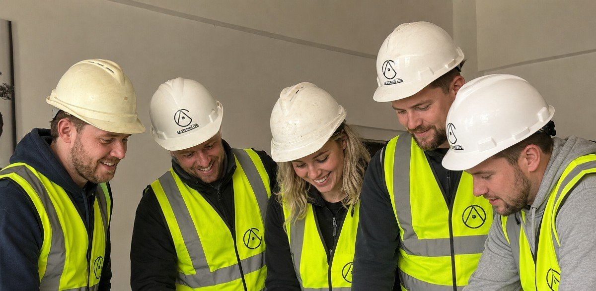A workplace training session in progress with a Cumbria employer's team